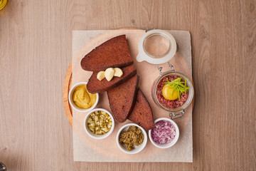snack in the restaurant set with black bread and sauces and garlic