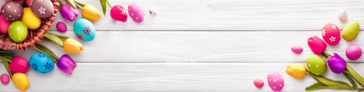 Easter Eggs With Flowers On White Wooden Background