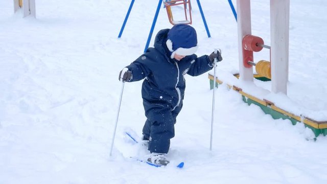 child skiing in the winter forest