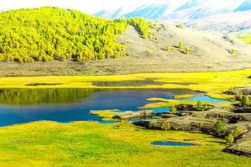View of the Sunny mountain valley with lakes and rivers. Journey through the Altai Republic.