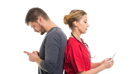 Male patient and lady doctor texting on smartphones.