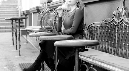 the girl drinks coffee