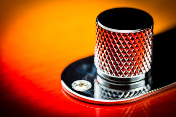 Macro close up of an electric guitar volume knob with interesting pattern