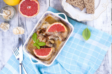 Chicken fillet with grapefruit baked in the oven. Beautiful dishes with a picture. Useful dinner. Tasty food.