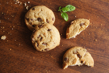 cookies with chocolate on a wooden background