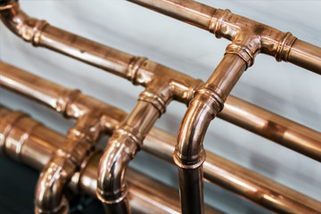 copper pipes and fittings for carrying out plumbing work. - obrazy, fototapety, plakaty