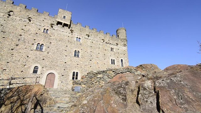 Ussel fraction of Chatillon, Valle d'Aosta, Italy 11 February 2018. Film of the facade of the medieval castle of Ussel. Camera movement from right to left.
