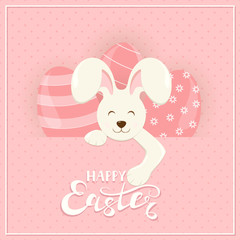 Easter bunny and eggs behind a banner on pink background