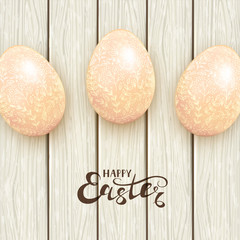 Easter eggs with floral pattern on white wooden background