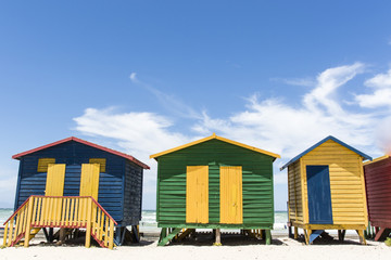 Fototapeta na wymiar Colorful huts/ houses along the beach in Muizenberg, South Africa