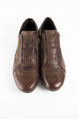 Male brown leather shoe on white background, isolated product, comfortable footwear.