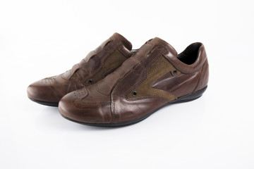 Male brown leather shoe on white background, isolated product, comfortable footwear.