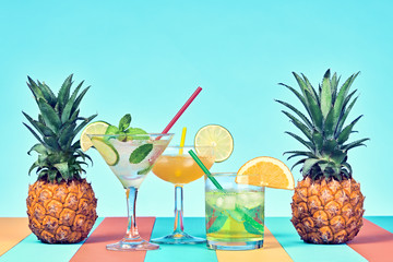 Two Pineapple with Cocktail on Beach. Tropical Fruit Pineapple. Bright Summer Color. Fashion Style. Creative Art. Fun Summer party Mood