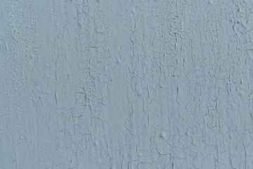 Cracked from time to time the paint on the painted wall. Cracks are long and short. There are bumps...