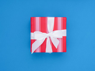 Fototapeta premium Wrapped gift box. Pastel Colour flat lay minimal concept. Palace blue.
