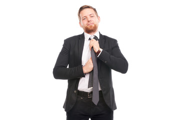 Portrait of young businessman wearing suit, white shirt and necktie
