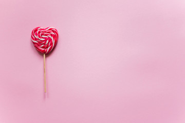 heart in the form of candy on pink backgraund
