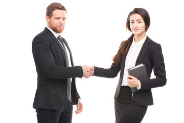 Portrait of Caucasian businessman and Asian businesswoman cooperating