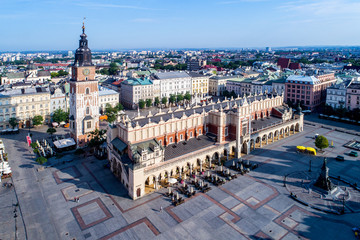 Fototapeta Krakow old city in Poland with Main Market Square (Rynek), old cloth hall (Sukiennice), town hall tower and renovated Mickiewicz statue.  Aerial view obraz