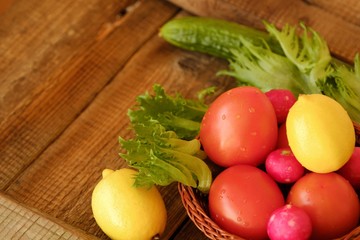 Summer vegetables and fruits on a wooden table 