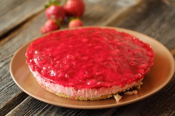 Fresh strawberry pie and berries on the table  