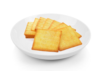 Cracker in plate on white background