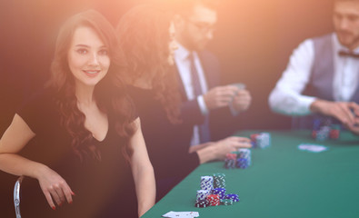 modern business woman sitting at craps table in a casino.