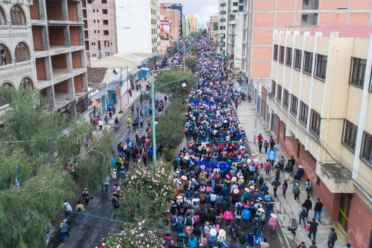 People march in the steets of Cochabamba, Bolivia