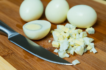 Obraz na płótnie Canvas Cut boiled eggs to prepare different dishes.