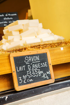 Closeup of sign - "Donkey Milk Soap" ("Savon Lait d'Anesse" in French).