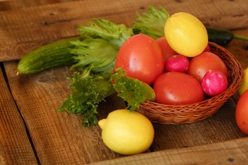 Summer vegetables and fruits on a wooden table 