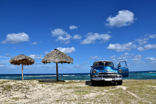 American Classic Car On Cuban Beach, Cuba. 