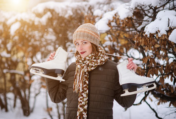 the girl on the figured skates on a opened skating rink