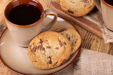 High angle view of chocolate chip cookies and cup of coffee