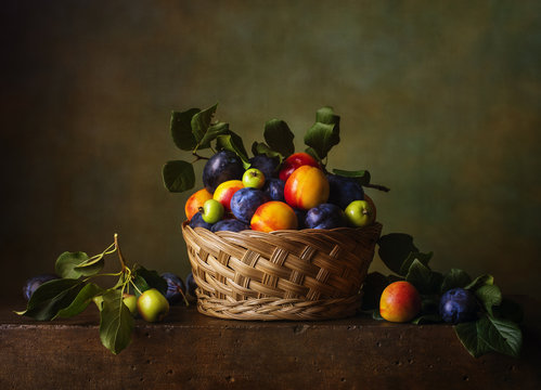 Still life with nectarines and plums