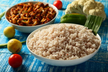 Healthy diet- cooked rice with bran and vegan roast curry dish