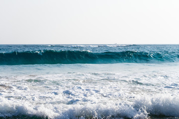 Naklejka na ściany i meble Beautiful blue wave in tropical ocean. Turquoise wave barrel crashing in sea. Close up.
