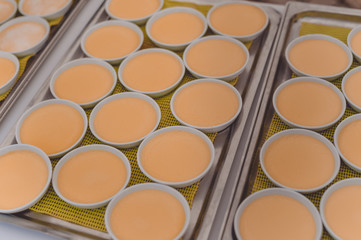 Custard making process, delicious decorated light table background, close up view