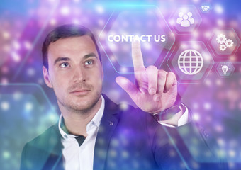 Business, Technology, Internet and network concept. Young businessman working on a virtual screen of the future and sees the inscription: Contact us