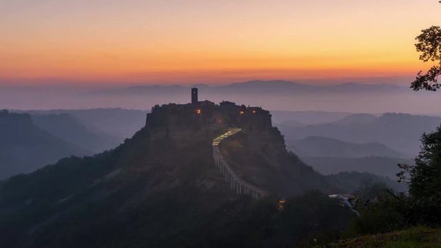 Sunrise Time Lapse of Civita old town in Italy (Civita di Bagnoregio) - Civita is noted for its striking position atop a plateau of volcanic tuff. It is the famous travel destination in central Italy.