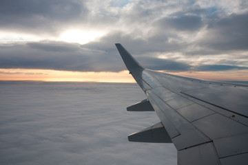 Naklejka na ściany i meble Clouds, airliner wing