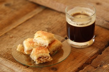 Delicious baklava dessert with nuts and honey and coffee 
