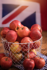 british apples in basket with UK flag background 