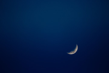 the moon with the blue sky