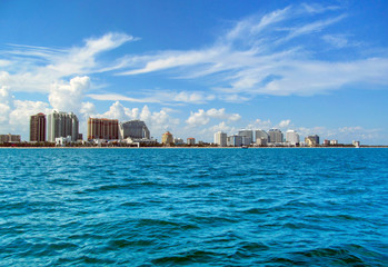 Fort Lauderdale, near Miami, Florida, USA. 
Landscape of beach skyline and coastal luxurious buildings against blue sky a summer sunny day. Panoramic view from the ocean surface.