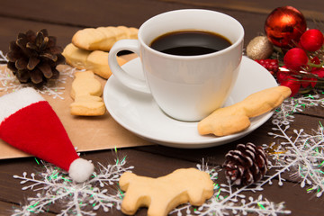 Cup of coffee with cookies on Christmas morning, a special toning. Christmas template. Selective focus