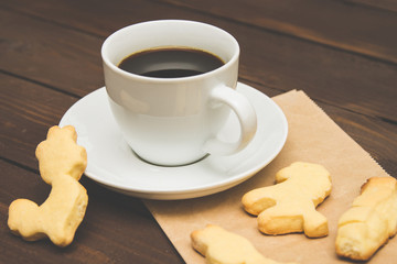 Cup of coffee with cookies on Christmas morning, a special toning. Christmas template. Selective focus