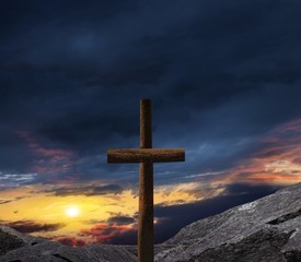 Cross against the sky  . Dramatic nature background .  Light from sky . Religion background . God's cross .  Prayer time . healing by belief