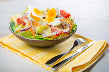 vegetable salad on yellow towel