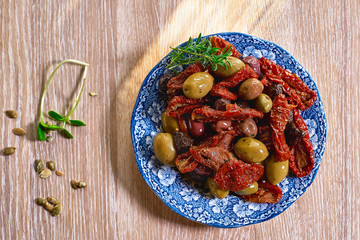 Pickled vegetables on the wooden background